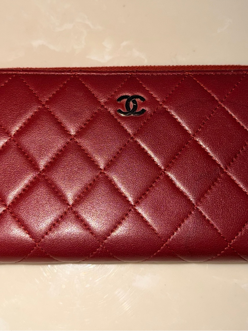 CHANEL Quilted Burgundy Leather Wallet with CC Emblem
